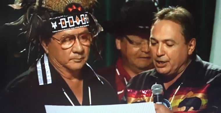 Mohawk elder Mike Mitchell swears in re-elected AFN leader Perry Bellegarde.