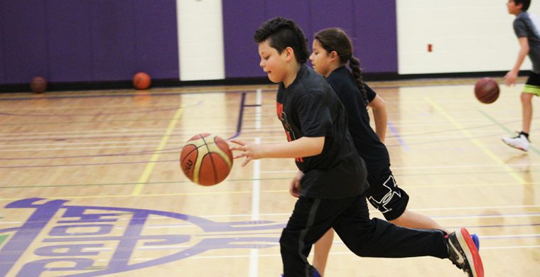 Many of the kids need to learn the fundamentals such as dribbling, ball handling and shooting form. (Photo by Josh Giles)