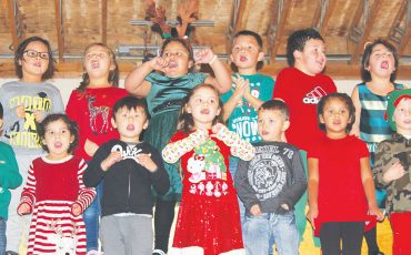 Jamieson Kindergarten students belt out a Christmas tune during their annual Christmas concert. Photo by Donna Duric.