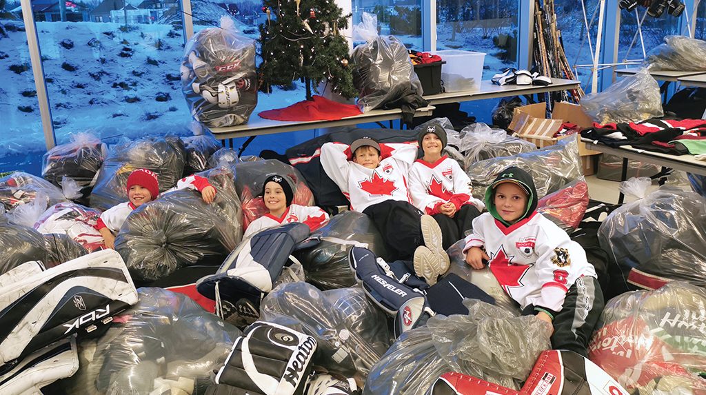 Players from the PMHA Atom Rep Wolfpack celebrated the huge supply of equipment they raised for children living on First Nations in Northern Ontario. (Photo By Justin Leftbridge)