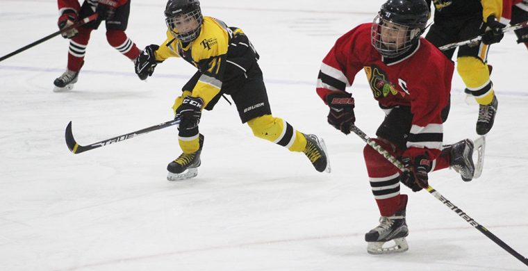 Team Captain Jacob Hill winding up to score his second goal of the game for the Peewee Rep team. (Photo By Josh Giles)