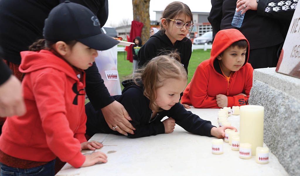 Those left behind In 2018 Six Nations mourned the loss of three community members killed in a vicious triple murder. Their families and children were left behind and showed they have not forgotten them by lighting candles at Ganohkwasra’s Red Dress Day Candlelight Vigil. (Photos by Jim C. Powless)
