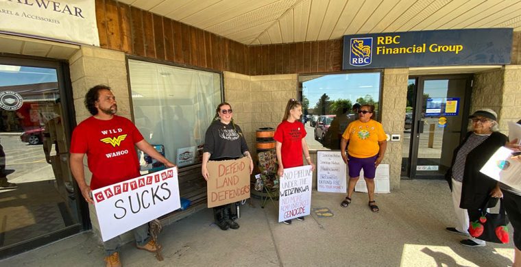 A peaceful demonstration was held outside the bank in Ohsweken to draw attention to corporate banks funding pipelines. (Photo by Jim C.Powless)