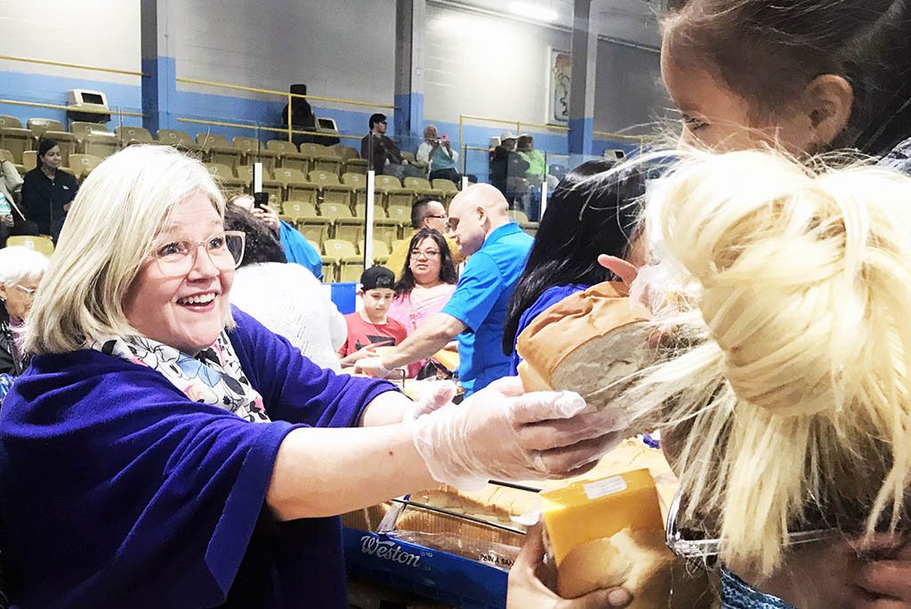 City of Hamilton’s new Mayor Andrea Horwath was one of several area mayors who joined in Six Nations annual Bread and Cheese fun Victoria Day at the SN Arena handing out over 8500 individually wrapped cheese packages and 2200 loaves of bread to all who came, Six Nations people and … friends. (Photo by Lisa Iesse)