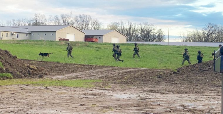 The OPP Tactical Unit search along Highway 54 Thursday (May4) morning after two men entered a local store demanding cash.