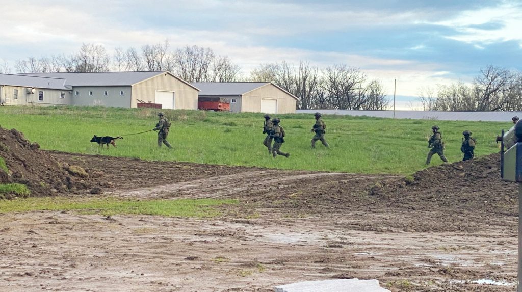 The OPP Tactical Unit search along Highway 54 Thursday (May4) morning after two men entered a local store demanding cash.