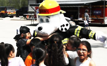 Six Nations Community Awareness week and one of the favourite spots is Six Nations Fire department where everyone has hugs for Sparky! (Photo by Jim C. Powless)