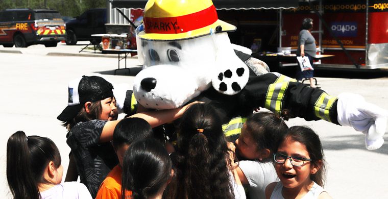 Six Nations Community Awareness week and one of the favourite spots is Six Nations Fire department where everyone has hugs for Sparky! (Photo by Jim C. Powless)