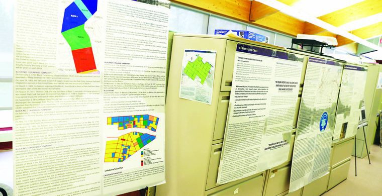 Posters mounted on walls and cabinets showing potential claims information. (Photo Lisa Isse)