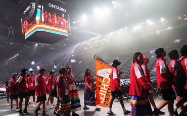 The North American Indigenous Games have officially opened.  Prime Minister Justin Trudeau attended as thousands of Indigenous athletes from across the continent filled the downtown Halifax Forum Civic Centre. A Team Ontario athlete carries a “Every Child Matters” flag on a lacrosse stick during the opening ceremony of the North American Indigenous Games 2023 in Halifax, Sunday, July 16, 2023. THE CANADIAN PRESS/Darren Calabrese