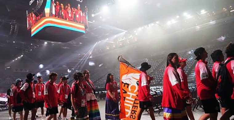 The North American Indigenous Games have officially opened.  Prime Minister Justin Trudeau attended as thousands of Indigenous athletes from across the continent filled the downtown Halifax Forum Civic Centre. A Team Ontario athlete carries a “Every Child Matters” flag on a lacrosse stick during the opening ceremony of the North American Indigenous Games 2023 in Halifax, Sunday, July 16, 2023. THE CANADIAN PRESS/Darren Calabrese