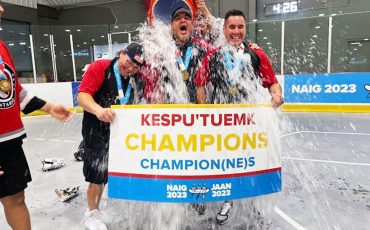 Darcy Powless (on left) and other Team Ontario coaches get a celebratory soak after winning a gold medal at the North American Indigenous Games. (Photo courtesy Darcy Powless.)