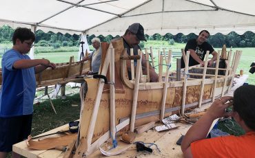 Coming together to build a canoe (Photo by Lisa Iesse)