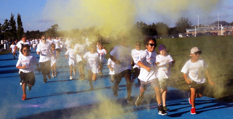 The biggest crowd showed up Friday at the Blue Track and quickly became running rainbows after running for their colour in the Health departments annual Moment For Life Colour in recogniton of World Suicide Awareness Day. (Photo by Jim C. Powless)