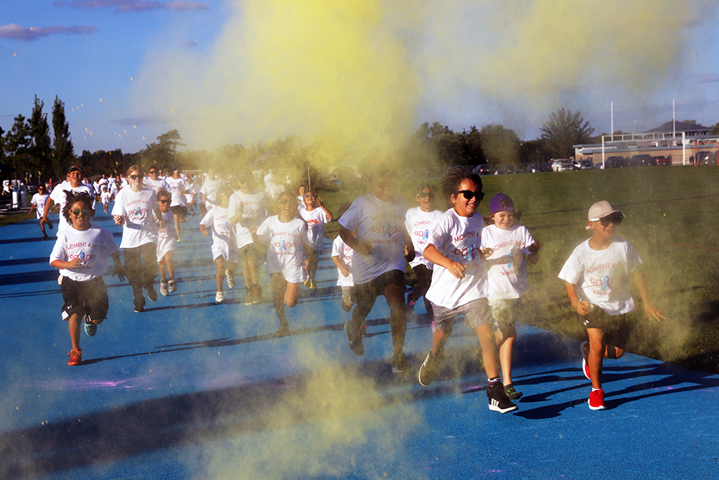 The biggest crowd showed up Friday at the Blue Track and quickly became running rainbows after running for their colour in the Health departments annual Moment For Life Colour in recogniton of World Suicide Awareness Day. (Photo by Jim C. Powless)