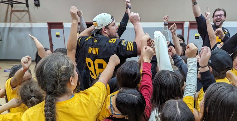 Go Ticats... Go Six Nations - Six Nations elementary school students teamed up with the Hamilton Tiger Cats for a round of football last week. (Photo by Lisa Iesse) See story page 9.
