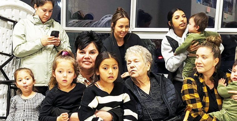 Sherri-Lyn Hill holds onto her grandchild as she learns she is Six Nations new Elected Chief. (Photo by Lisa Iesse)