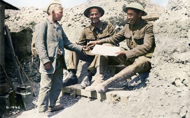 PTE Tom Longboat buys a newspaper from a French newspaper boy. June 1917 (Photo provided by Vimy Ridge Foundation)