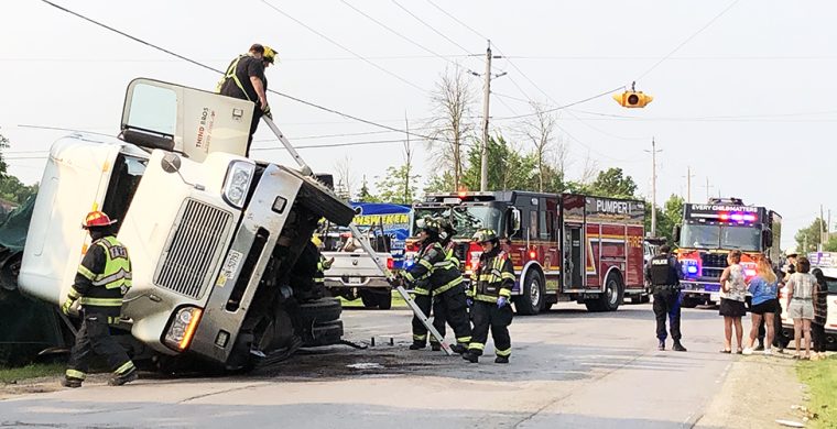 A commercial truck overturned on Chiefswood Road in July shutting down the road for hours. (Photo by Jim C. Powless)