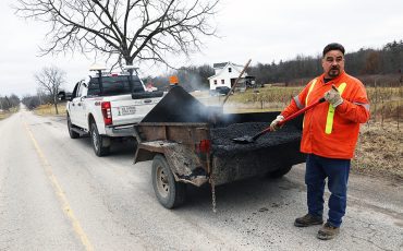 Ken Hess manually fills potholes all over Six Nations. Road crews have been kept particularly busy this year.