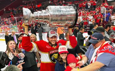 A SIX NATIONS WIN!!!! Brandon Montour hoists the Stanley Cup surrounded by his family and friends after the Florida Panthers 2-1 victory over the Edmonton Oilers (NHL Hockey Photo)!