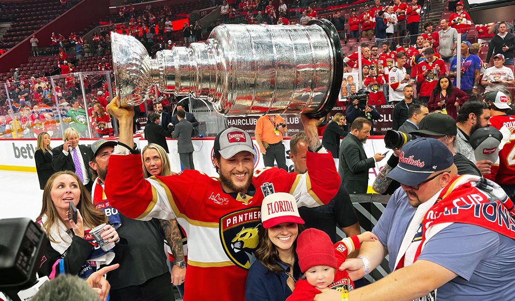A SIX NATIONS WIN!!!! Brandon Montour hoists the Stanley Cup surrounded by his family and friends after the Florida Panthers 2-1 victory over the Edmonton Oilers (NHL Hockey Photo)!