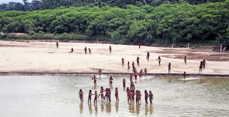 This June 2024 photo provided by Survival International shows members of the Mashco Piro along the Las Piedras River in the Peruvian Amazon near the community of Monte Salvado, in Madre de Dios province, Peru. (Survival International via AP)