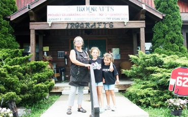 Nandell Hill stands with her granddaughters in front of her well known store.