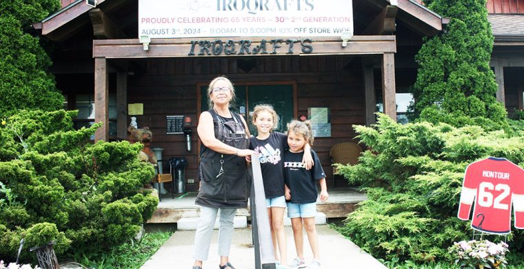 Nandell Hill stands with her granddaughters in front of her well known store.