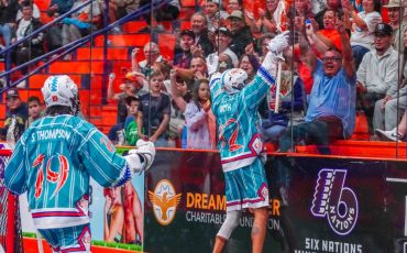 The Six Nations Chiefs and their fans celebrate a goal during the team's 10-4 victory in Game 2 of the Mann Cup series.