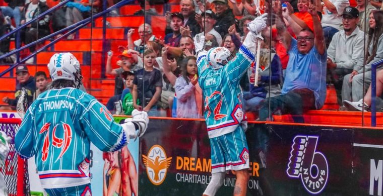 The Six Nations Chiefs and their fans celebrate a goal during the team's 10-4 victory in Game 2 of the Mann Cup series.