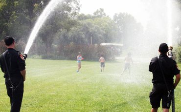 If there’s water, you will find a firefighter! Six Nations firefighters have fun in the sun at Six Nations Water Festival (Photo by Austin Evans).