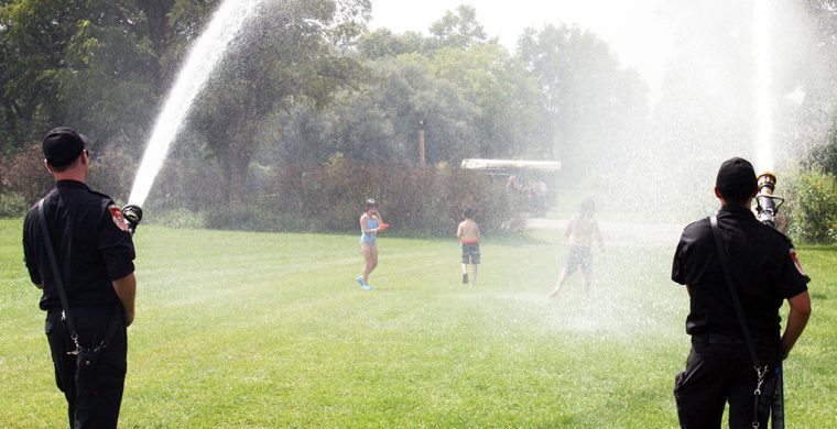 If there’s water, you will find a firefighter! Six Nations firefighters have fun in the sun at Six Nations Water Festival (Photo by Austin Evans).