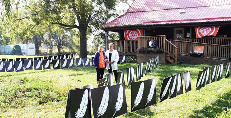 Mohawk Institute survivor Sherlene Bomberry and Survivors’ Secretariat Outreach Lead Misty Ladd stand among a display commemorating the children who died attending the Mohawk Residential School. See story and photos inside our special edition. (Photo by Austin Evans)