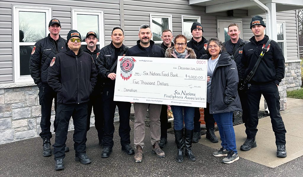 Six Nations giving spirit was in full force over the holidays including from the Six Nations Fire Fighters Association who donated $6,000 to the Six Nations Food Bank. The donation came from their first annual golf tournament held in 2024. The fire fighters included Alex Howling, Chancy Johnson, Ben Purchase, Charles Gamble, Martin MacNaughton, Kevin McDonald, Rory Smith, Braiden Shaw, Kolton Debus. Six Nations Food Bank board chair Mary Monture and coordinator Tracey Martin.