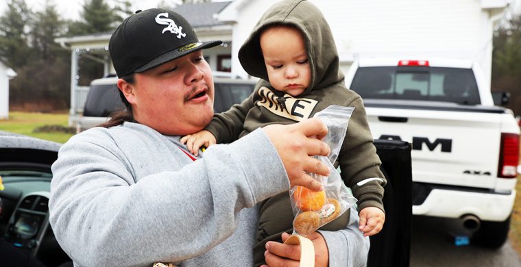 No:ia, No’:yah! Six Nations community members like Colton and Oaklin Martin joined in welcoming 2025 with the traditional New Year welcome visiting family and friends and receiving a donut at the door. (Photo by Jim C. Powless)