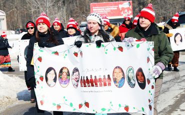 Families, friends and supporters hit Chiefswood Road at Six Nations of the Grand River on Feb. 14, for a Valentine’s march through Ohsweken taking part in the annual Murdered and Missing Indigenous Women Day Memorial March, an annual event honouring Missing and Murdered Indigenous Women and Girls (MMIWG) across Canada. (Photo by Jim C. Powless)