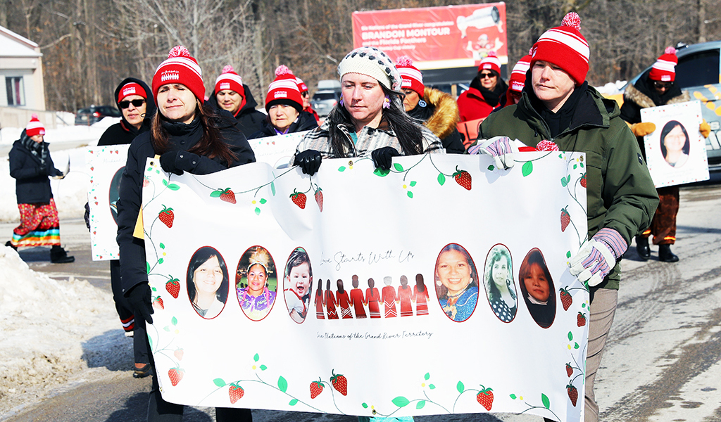 Families, friends and supporters hit Chiefswood Road at Six Nations of the Grand River on Feb. 14, for a Valentine’s march through Ohsweken taking part in the annual Murdered and Missing Indigenous Women Day Memorial March, an annual event honouring Missing and Murdered Indigenous Women and Girls (MMIWG) across Canada. (Photo by Jim C. Powless)