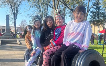 Jordyn Powless, front, Keona Moore, Jodi Powless, Averlee Moore and Eli R-M enjoy the view from a cannon at Veterans Park on May 8.