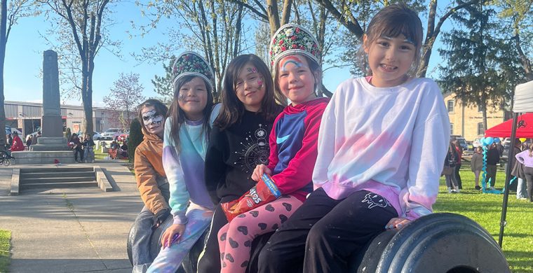 Jordyn Powless, front, Keona Moore, Jodi Powless, Averlee Moore and Eli R-M enjoy the view from a cannon at Veterans Park on May 8.