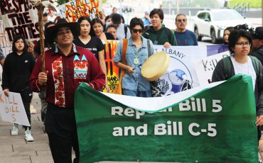 Above: A surprise rally of First Nation youth protesters walked to the entrance of the Canadian Museum of History in Gatineau, Quebec where hundreds of Chiefs from across Canada were meeting with Prime Minister Mark Carney concerning Bill C5. In front holding the banner from L-R are: Ramon Kataquapit, Attawapiskat FN and Cohen Chisel, Lac Seul FN.