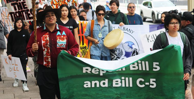 Above: A surprise rally of First Nation youth protesters walked to the entrance of the Canadian Museum of History in Gatineau, Quebec where hundreds of Chiefs from across Canada were meeting with Prime Minister Mark Carney concerning Bill C5. In front holding the banner from L-R are: Ramon Kataquapit, Attawapiskat FN and Cohen Chisel, Lac Seul FN.