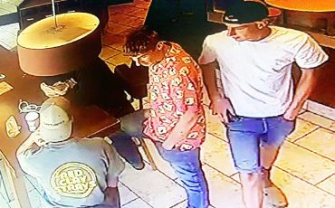 SNP seeking public’s help in identifying the suspects in these photos wanted after a smoke bomb was ignited in a business. (SNP Photos)