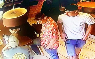SNP seeking public’s help in identifying the suspects in these photos wanted after a smoke bomb was ignited in a business. (SNP Photos)