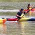 Six Nations firefighter Chancy Johnson, centre, takes and holds an early lead during the adult kayak race at Six nations Water festival on July 3 at Chiefswood Park. Johnson made first place to cheers from dock-filled audience - including some of his colleagues. (Photo by Jim C. Powless)