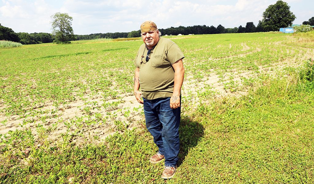 Landwner John Curley is caught with renting out his farm land only to find it was used as a testing site. (Photo by Jim C. Powless)