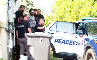Kahnawà:ke Police arrest a man after reports of a gun being fired into a crowd. A crowd had gathered outside with accusations of online photos of women being used inappropriately. (Supplied Photo)