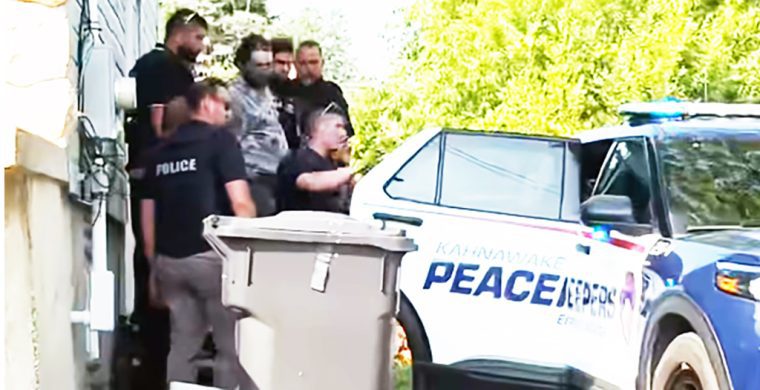 Kahnawà:ke Police arrest a man after reports of a gun being fired into a crowd. A crowd had gathered outside with accusations of online photos of women being used inappropriately. (Supplied Photo)