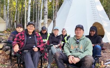 Here We Stand - Call To Action land protesters are continueing their work on the Attawapiskat River in protest against Ontario’s Bill 5 and Canada’s Bill C5. Pictured are the group at their permanent camp on the Attawapiskat River. From L-R: Konstantinov Wesley, Monique Wesley, David Kataquapit, Kerrie Blaise, Lucy Spence, James Kataquapit and Sage Iahtail. (Submitted photo)