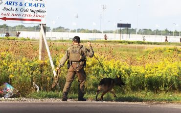 Six NationsPolice K9 unit was searching a poriton of Chiefswood Road and Fifth Line . (Photo by Jim C. Powless)
